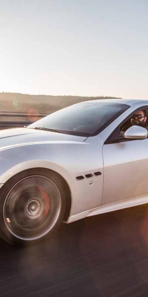 silver-sport-car-with-driver-highway